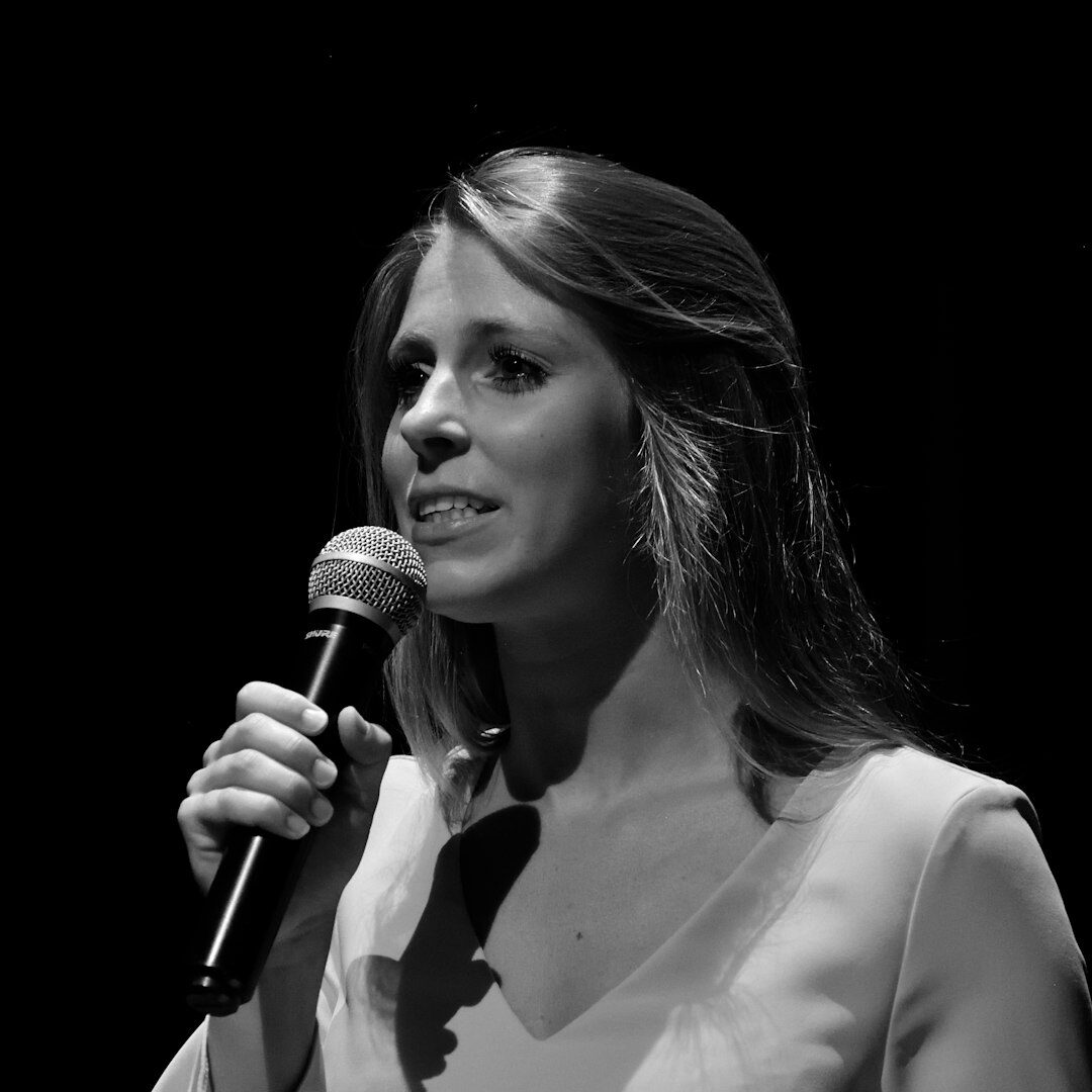 Journalist conducting an interview with a microphone