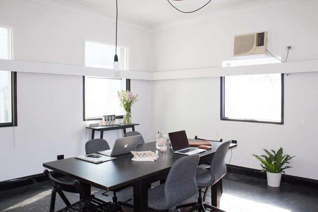 Modern open plan media office workspace with natural light